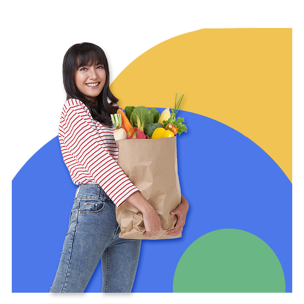 A woman holding a bag of groceries